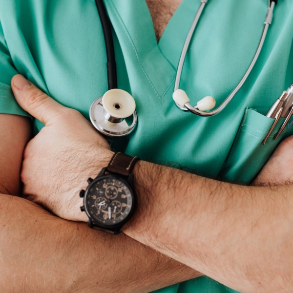 crop unrecognizable male doctor with stethoscope