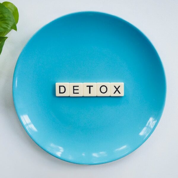 detox text on round blue plate