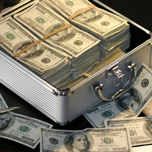 grey metal case of hundred dollar bills