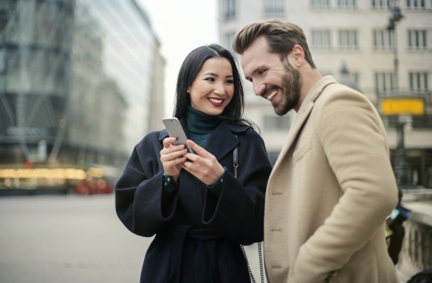 couple standing near buildings