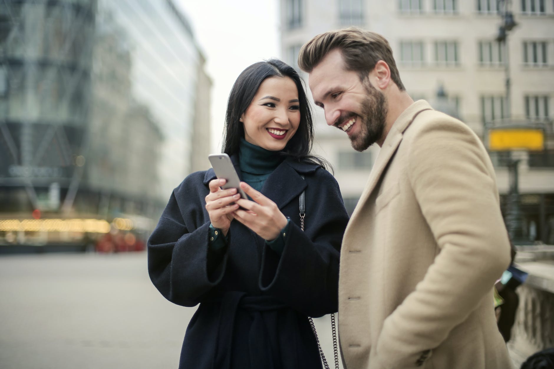 couple standing near buildings