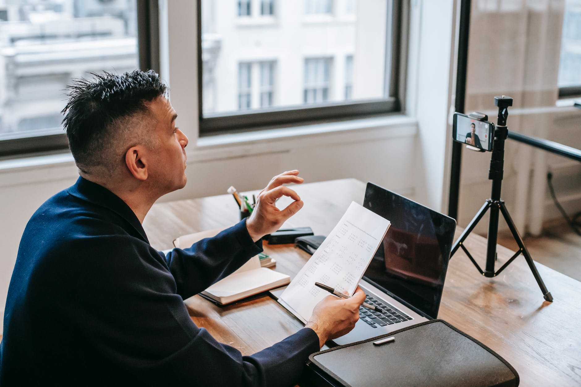 photo of man having an online education session