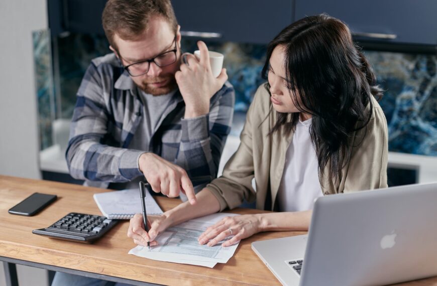 couple calculating all their bills