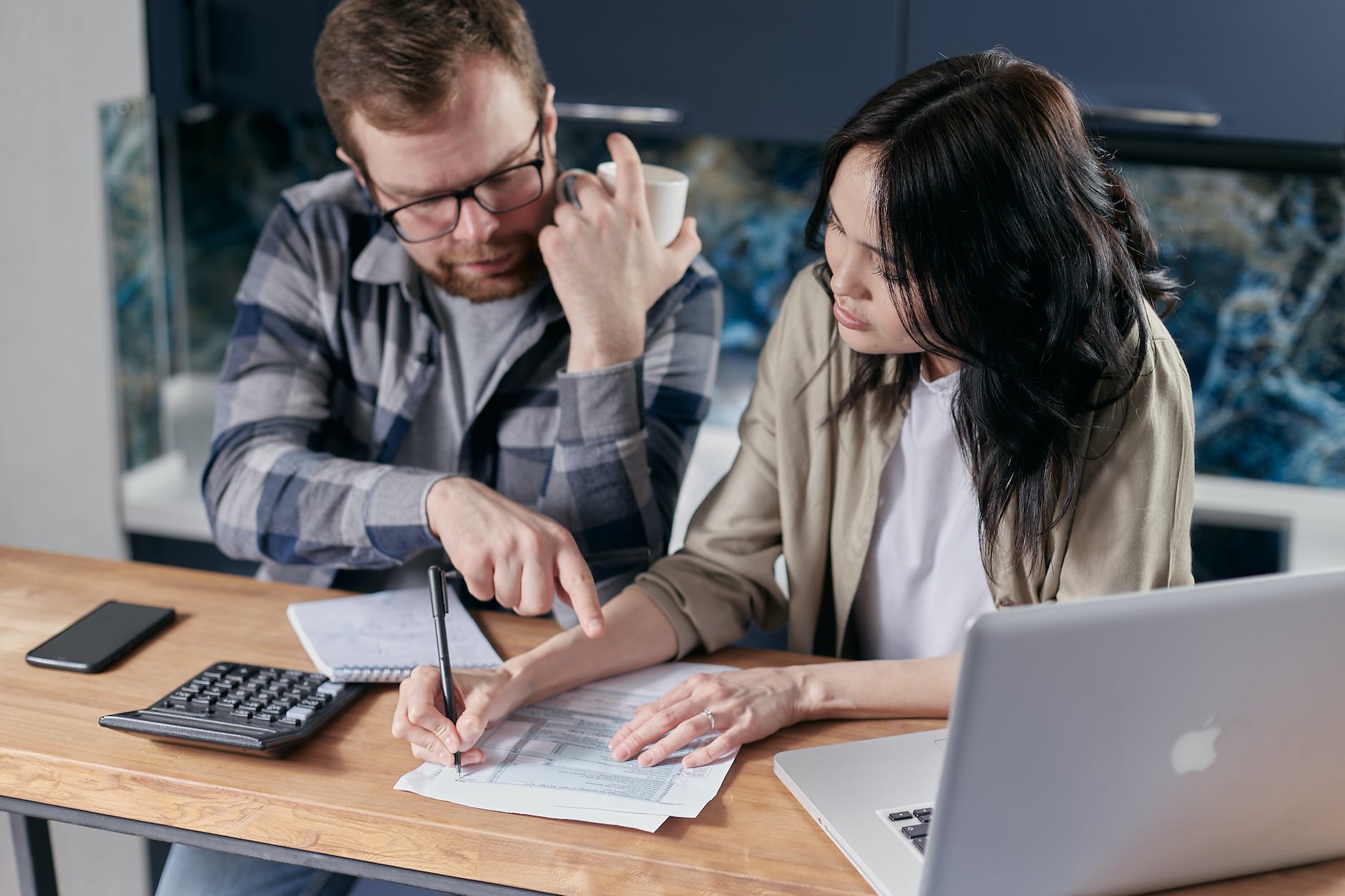 couple calculating all their bills