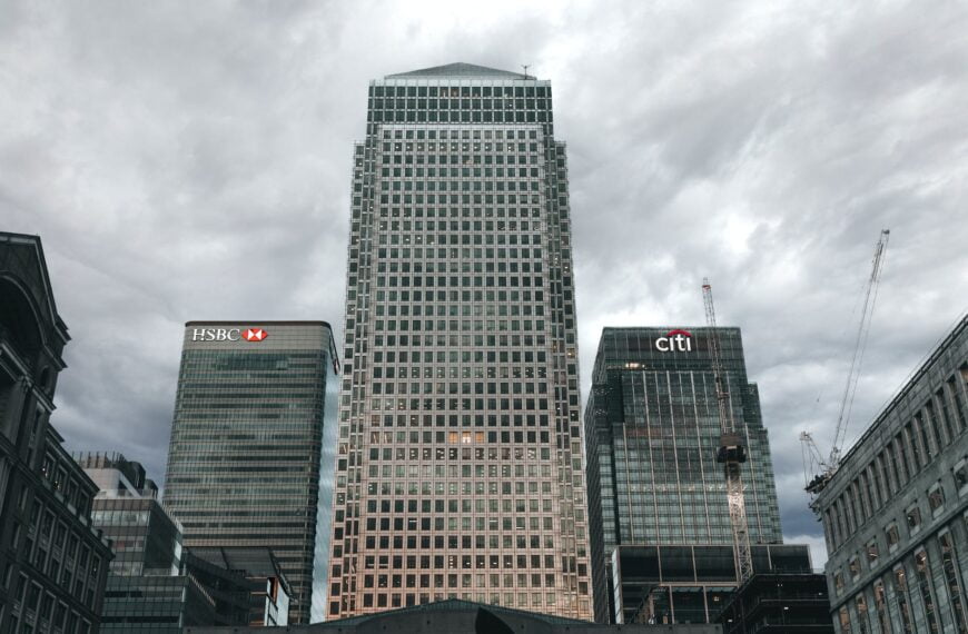 high rise buildings under a cloudy sky