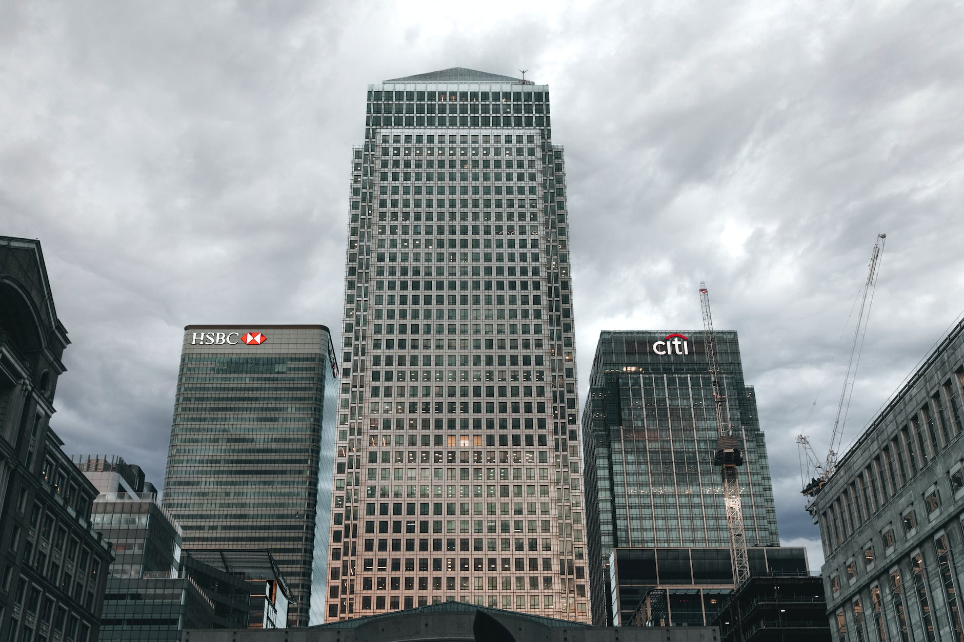 high rise buildings under a cloudy sky