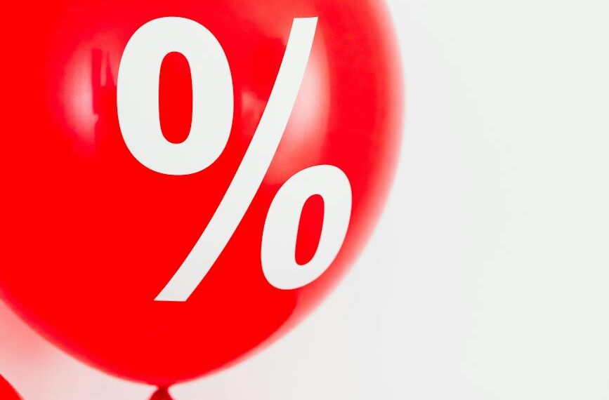 close up view of a red balloon with percentage symbol