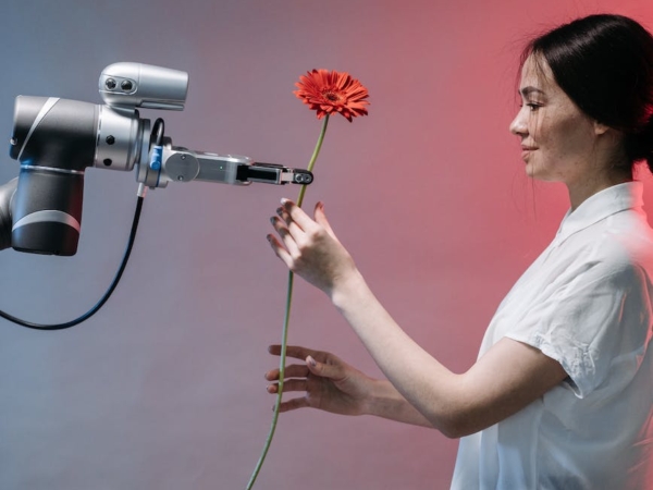 a robot holding a flower