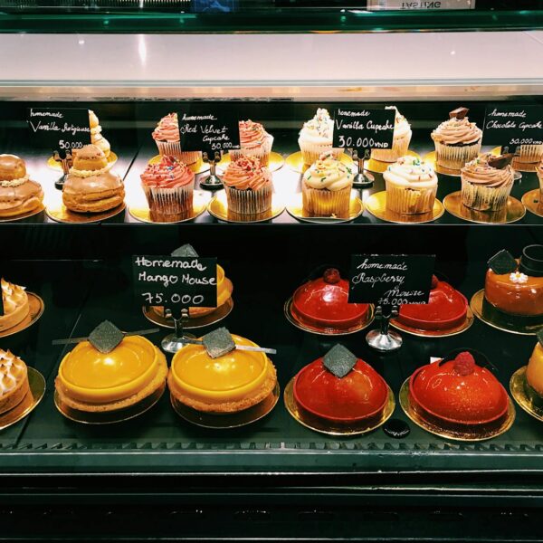 shelves of assorted cake in a bakeshop