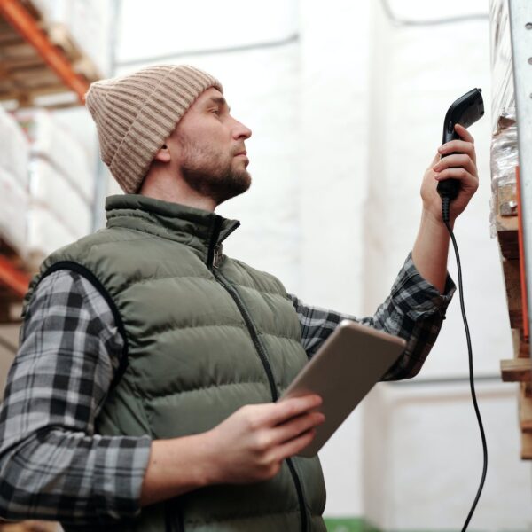 photo of a man scanning products in a warehouse