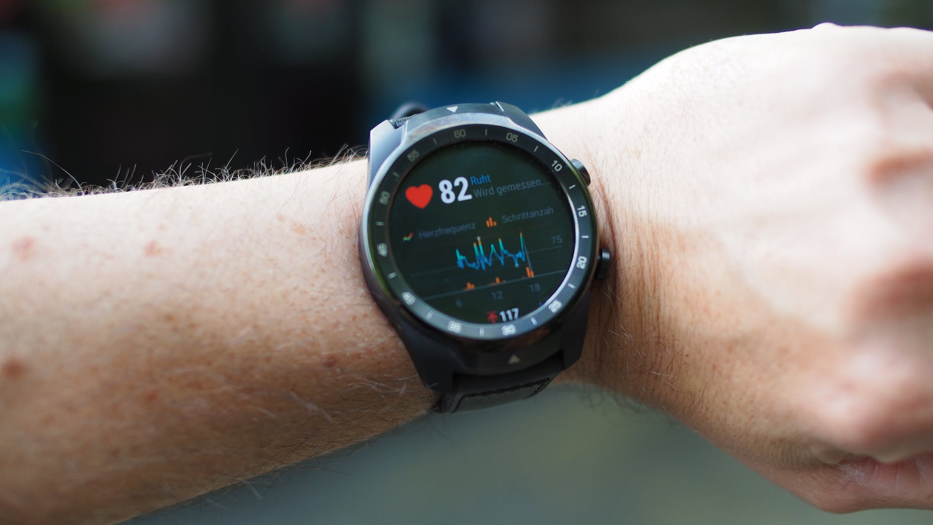 person wearing a heart rate monitor smartwatch