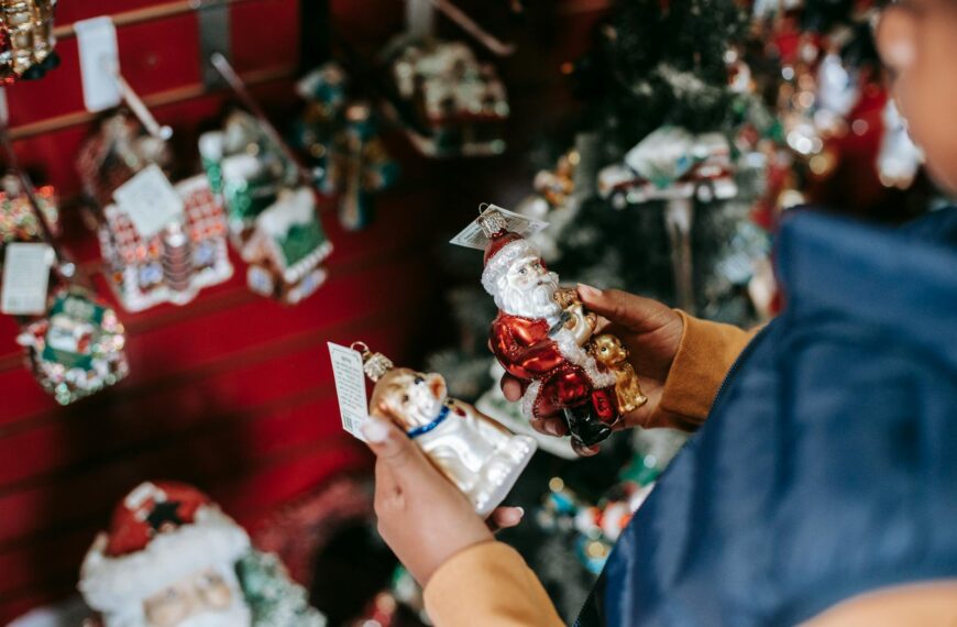 ethnic girl choosing toys for christmas tree