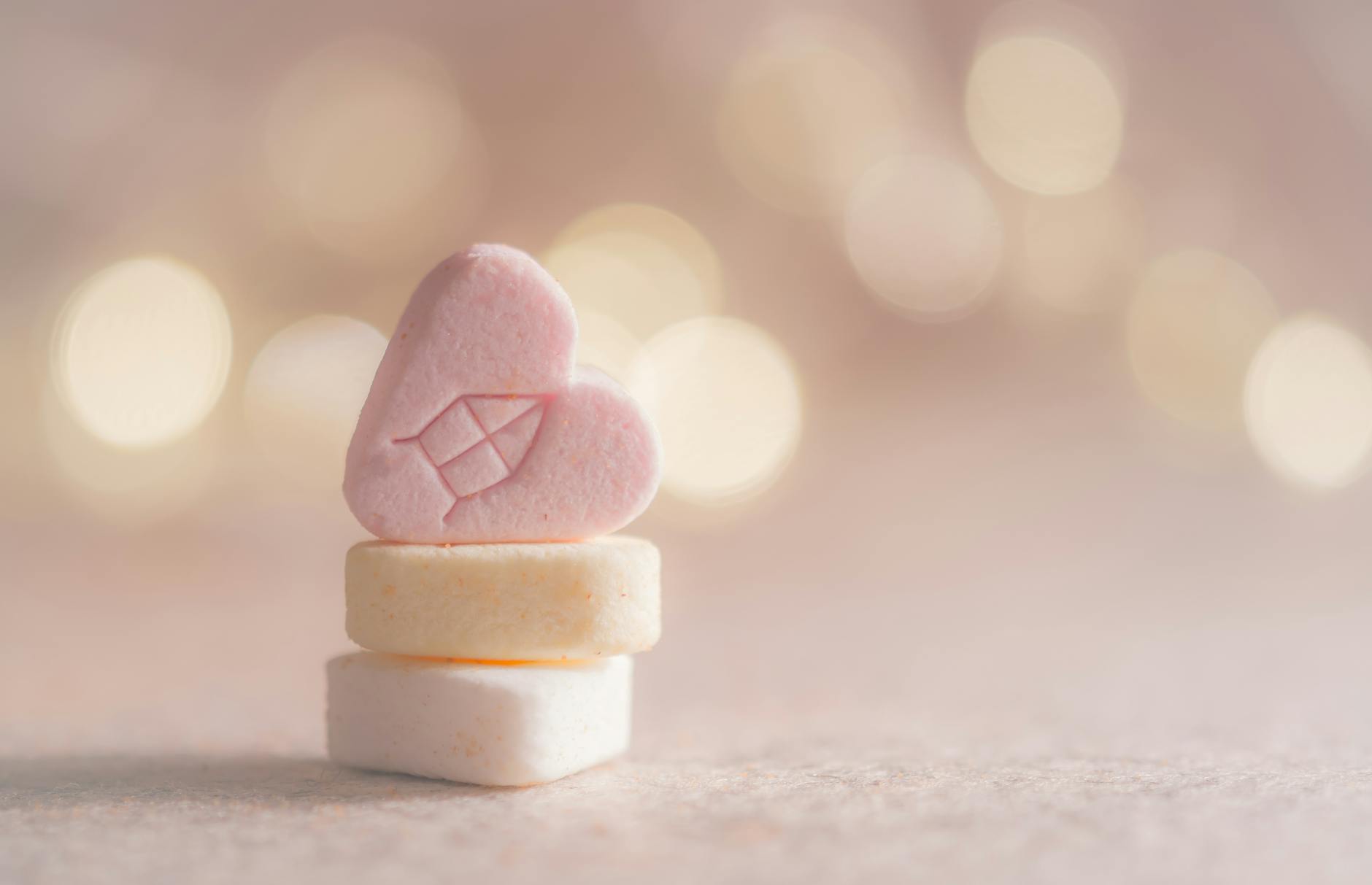 three beige yellow and pink heart marshmallows