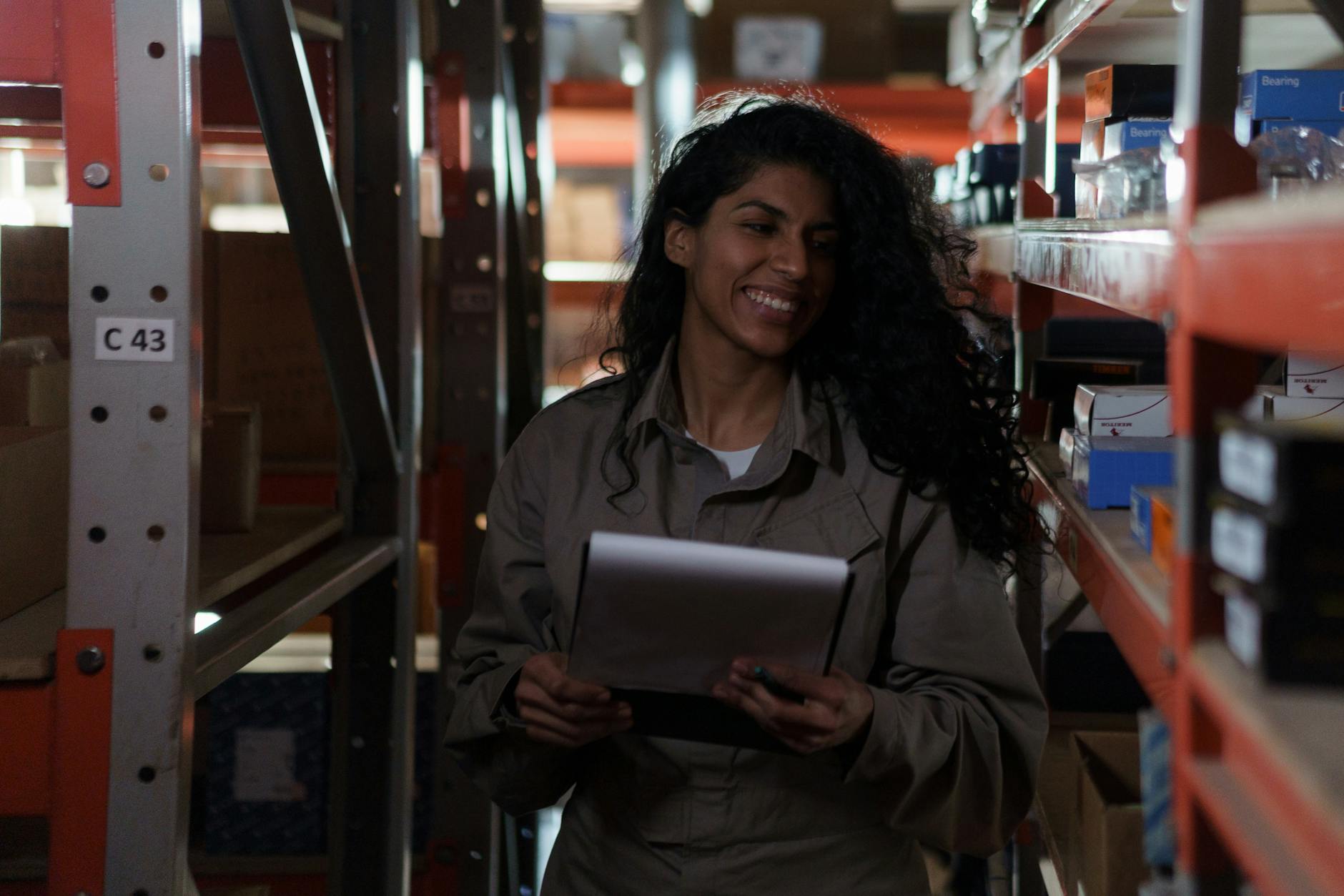 a woman on an aisle holding a clipboard