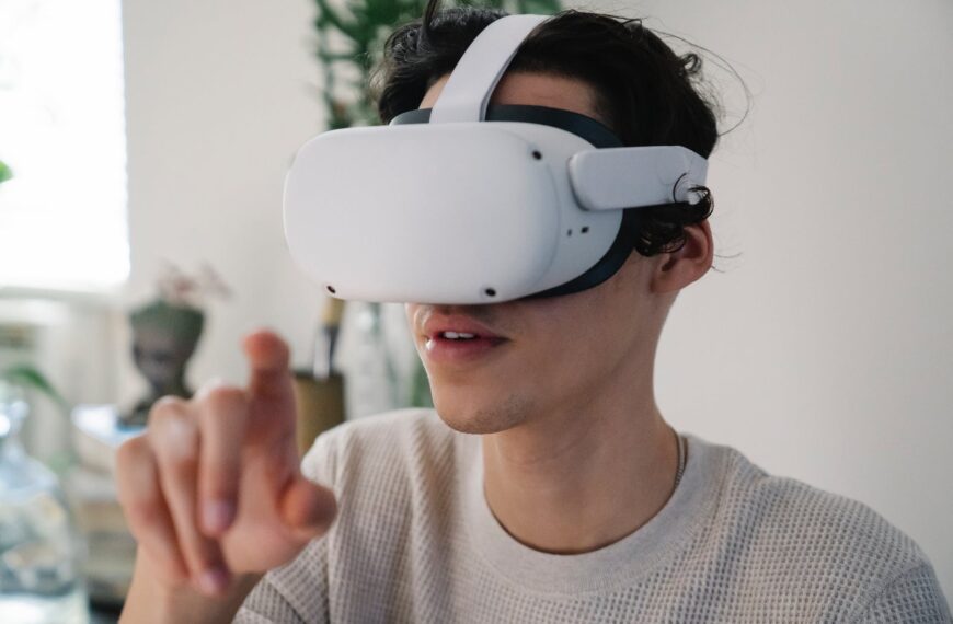 young male interacting with virtual reality headset in apartment