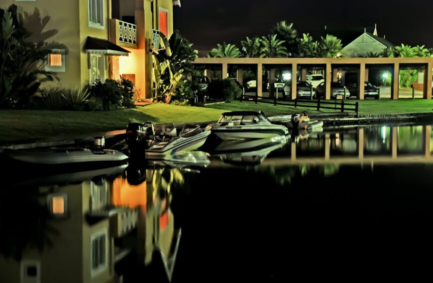 speed boats docked near house