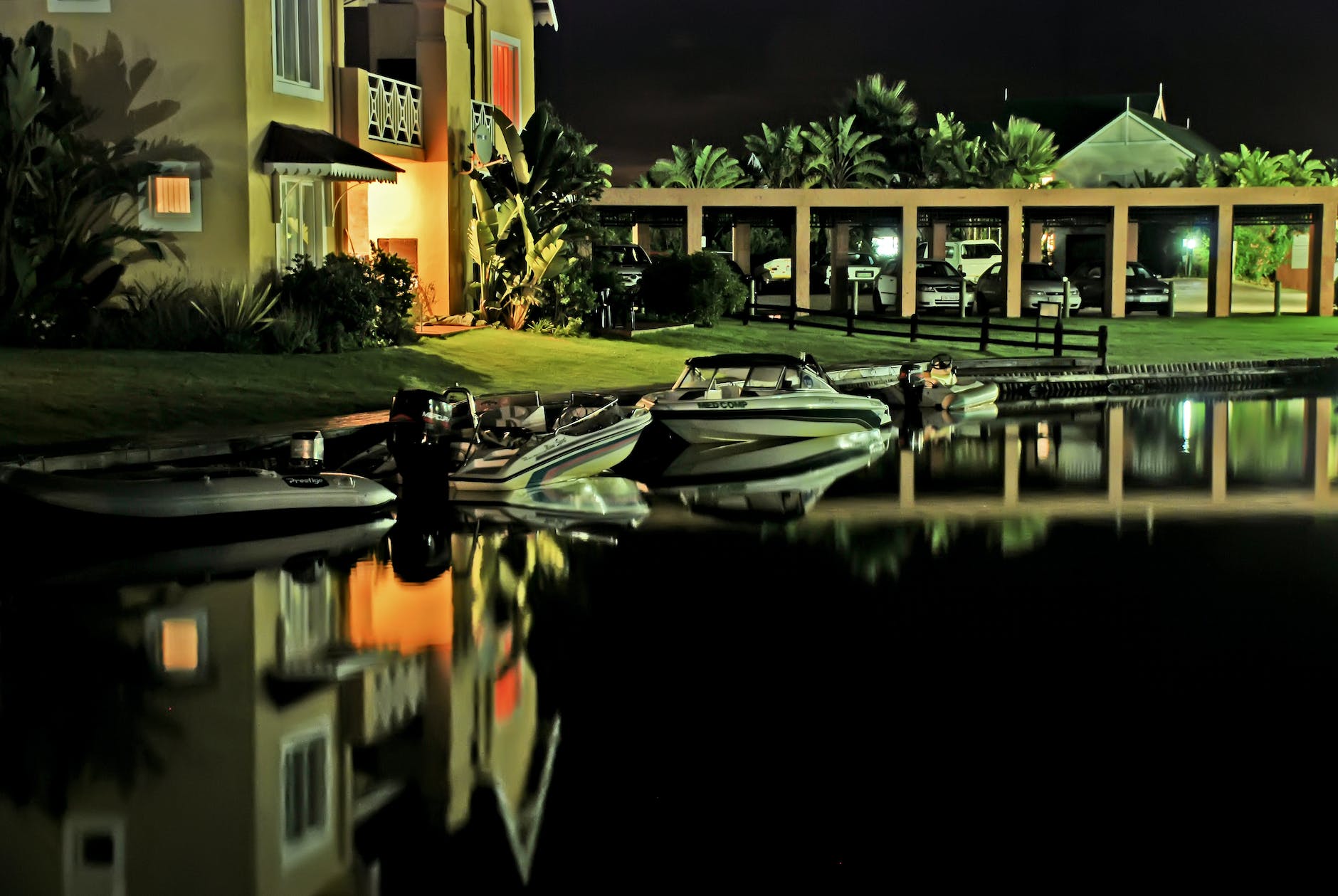 speed boats docked near house