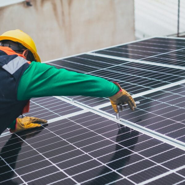 solar technician installing solar panel