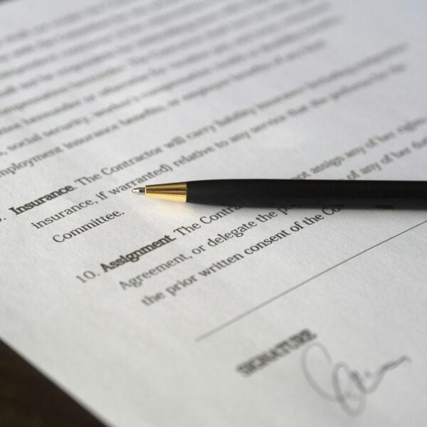 black pen placed on white paper