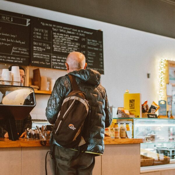man standing in front of counter