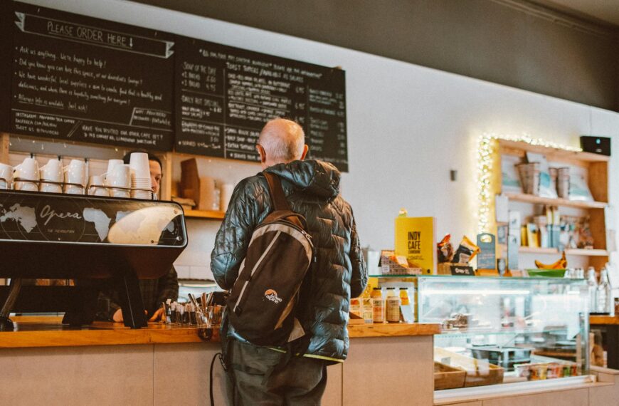 man standing in front of counter