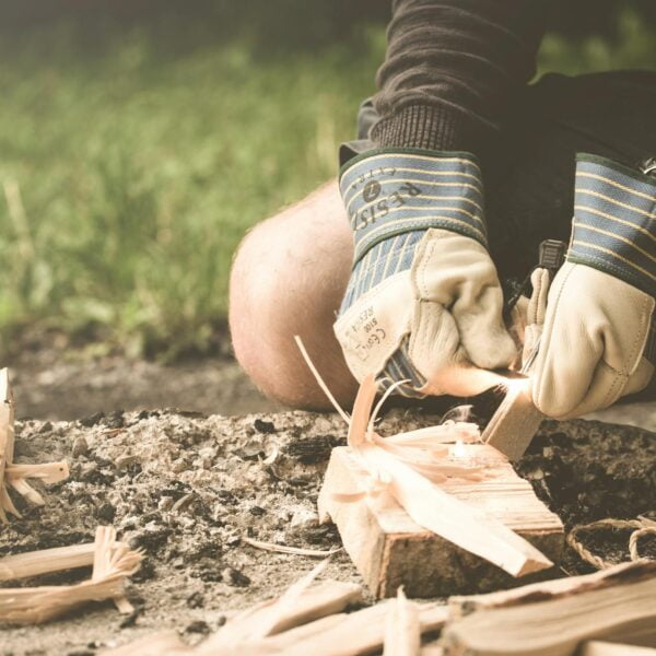 person curving wood