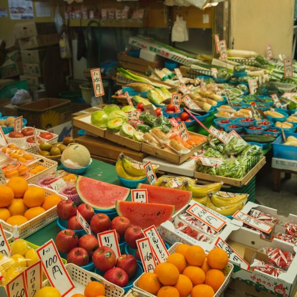 colorful fruits and vegetables placed on counter in local market