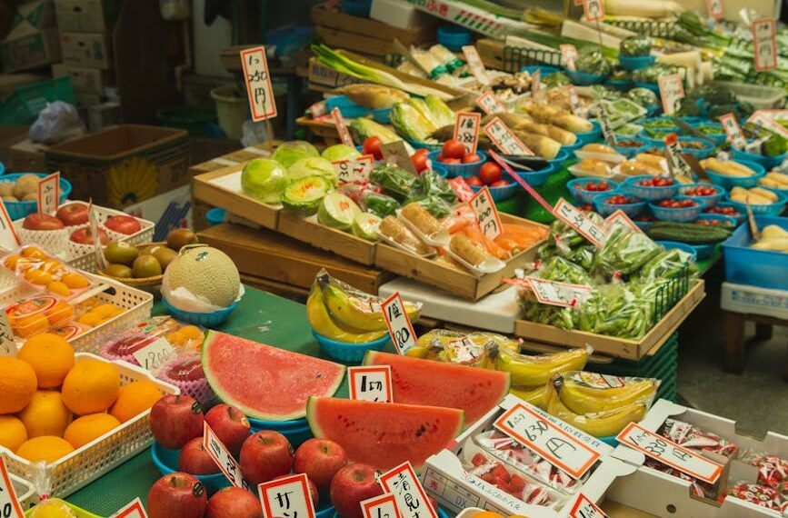 colorful fruits and vegetables placed on counter in local market