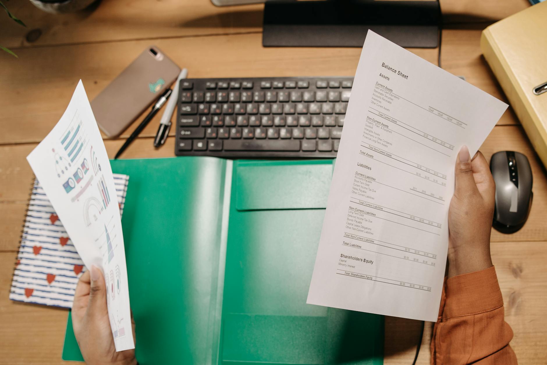 a person holding a financial statement